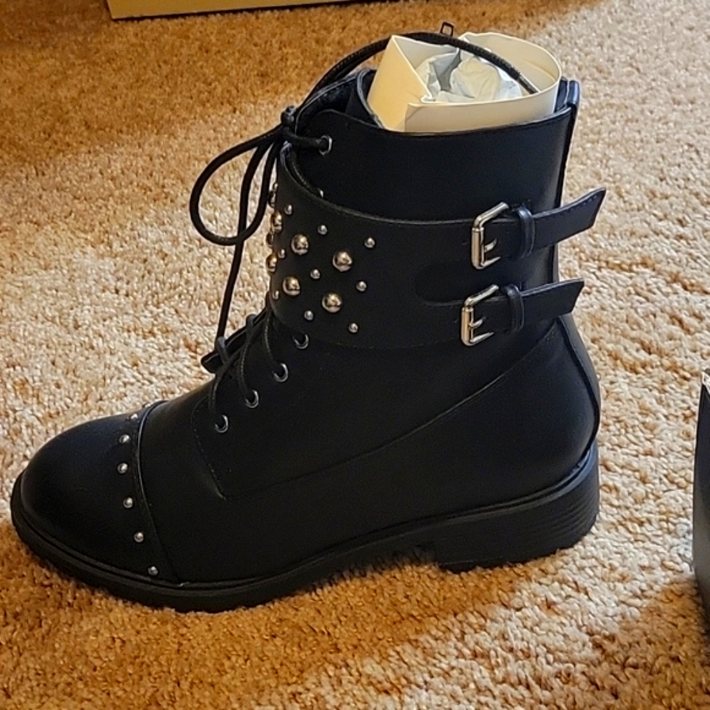 Black combat boots with silver detail